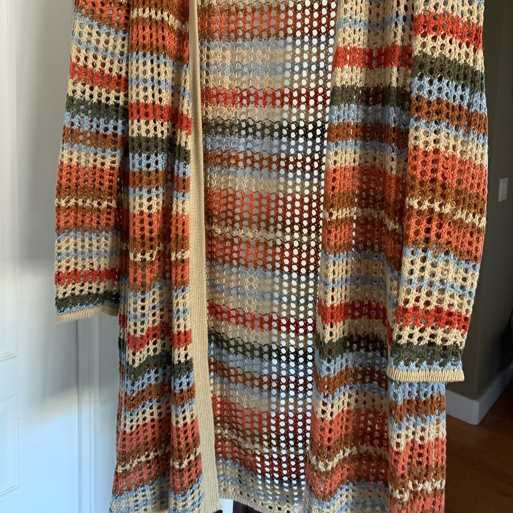 Knee length cardigan.